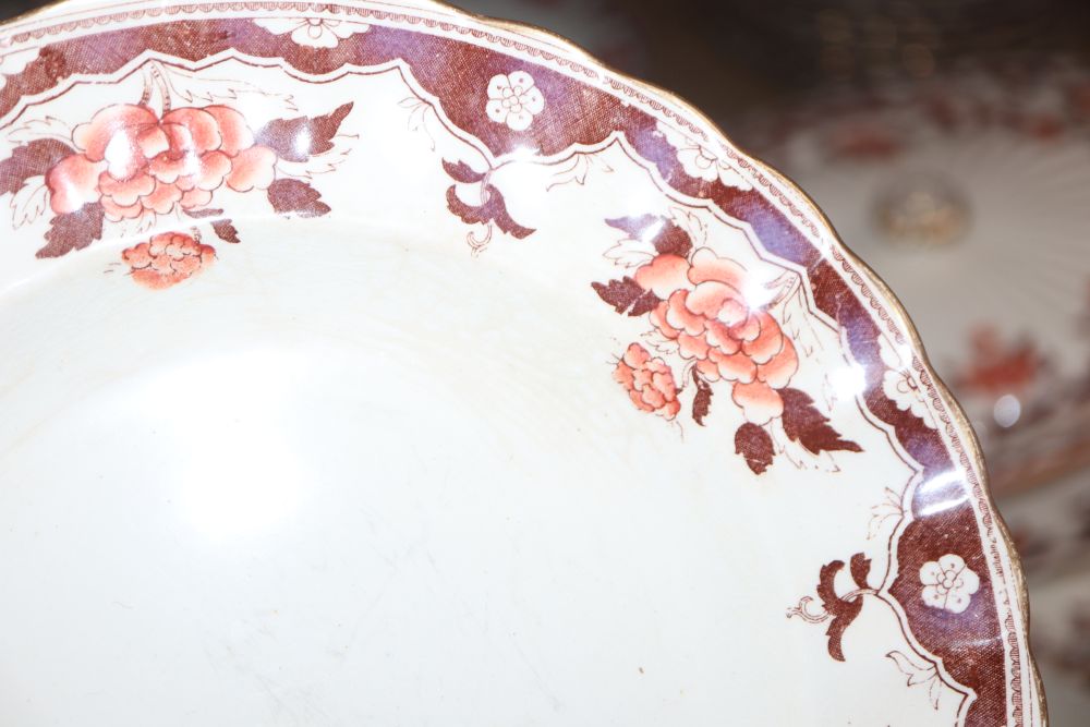 A Victorian Copeland part dinner service, transfer-printed with peonies and foliage in orange and brown,